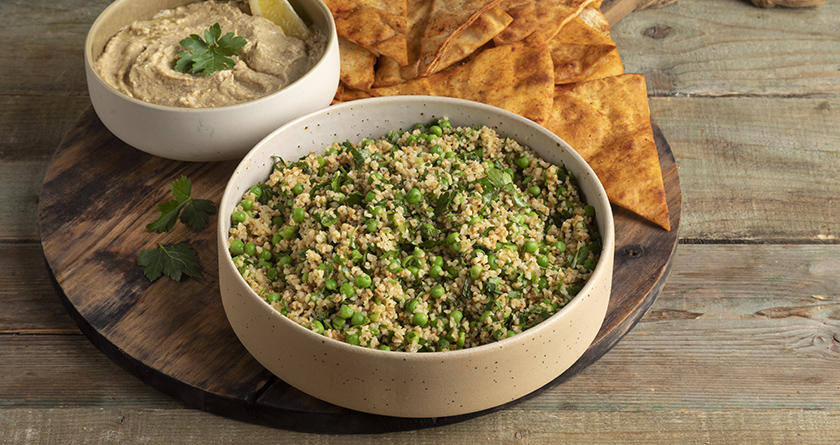 Vegan platter with green pea tabbouleh and hummus